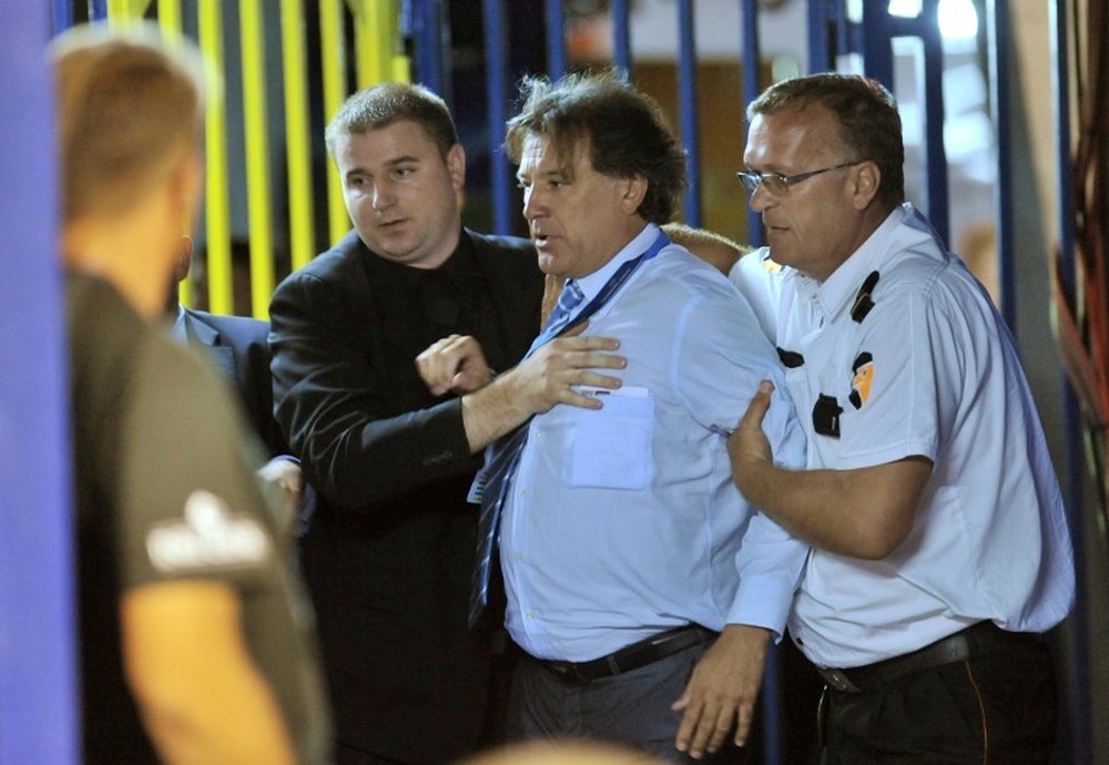 Dinamo Zagreb chief Zdravko Mamic (centre) is detained during his team 2011 match against Malmo in Zagreb