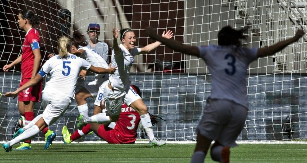 England Lucy Bronze (C) celebrates her goal against Canada with teammate Steph Houghton and Claire Rafferty (R) during the match at the 2015 FIFA Women World Cup in Vancouver on June 27, 2015