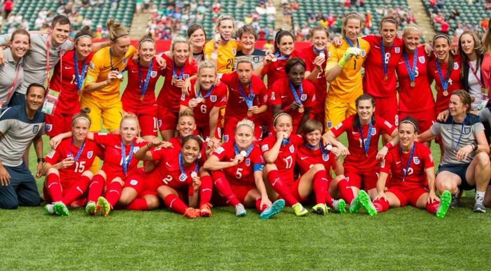 England players celebrate their bronze medal win at the FIFA Women's World Cup in Edmonton, Alberta on July 4, 2015