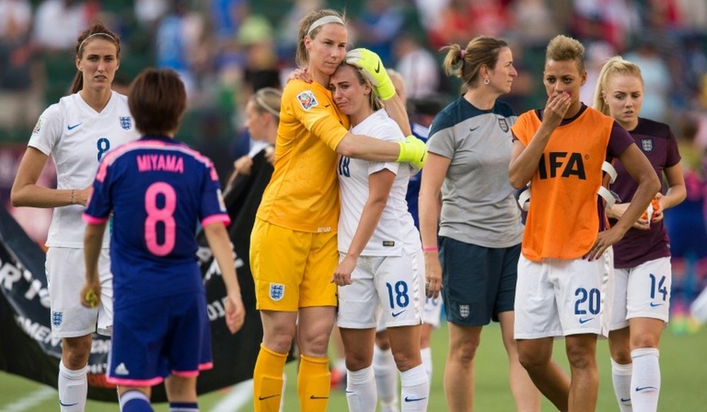 England players leave the pitch after their last second 2-1 loss to Japan in the FIFA Women World Cup semi-finals in Edmonton, Canada on July 1, 2015