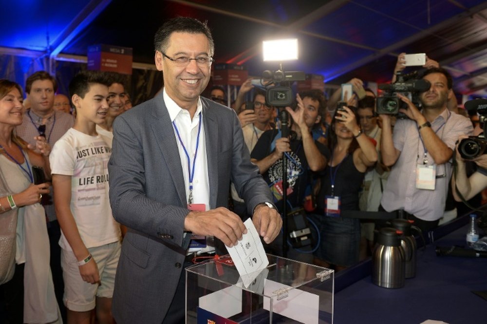 FC Barcelona ruling president Josep Maria Bartomeu casts his ballot during the elections at the Camp Nou stadium in Barcelona on July 18, 2015