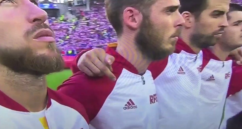 Gerard Pique appears to swear during Spain’s national anthem on Tuesday evening. Twitter