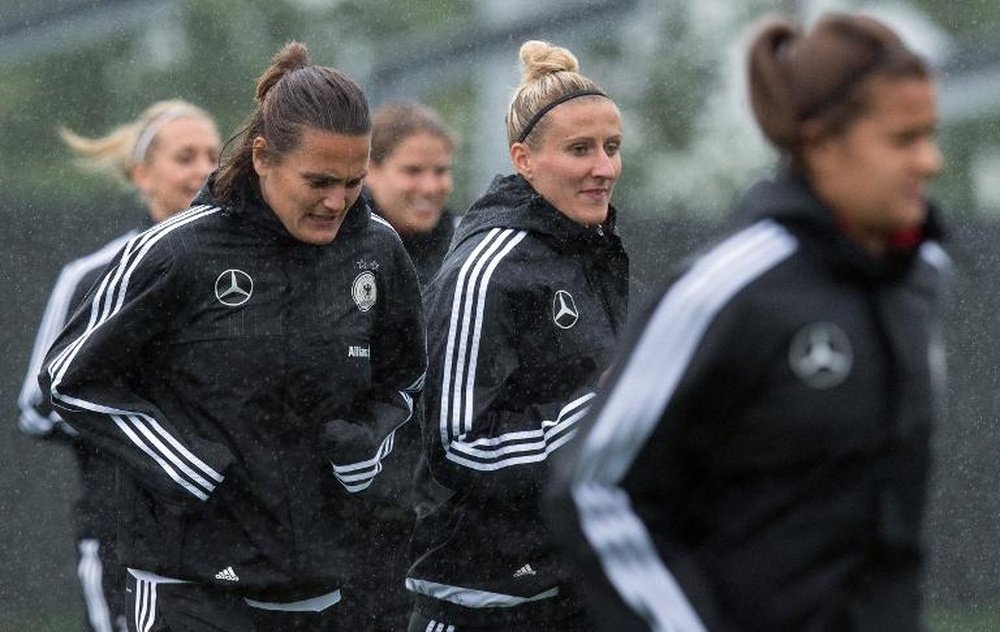Germany Nadine Angerer (left) and Anja Mittag jog during a training session in Montreal, Quebec on June 28, 2015.
