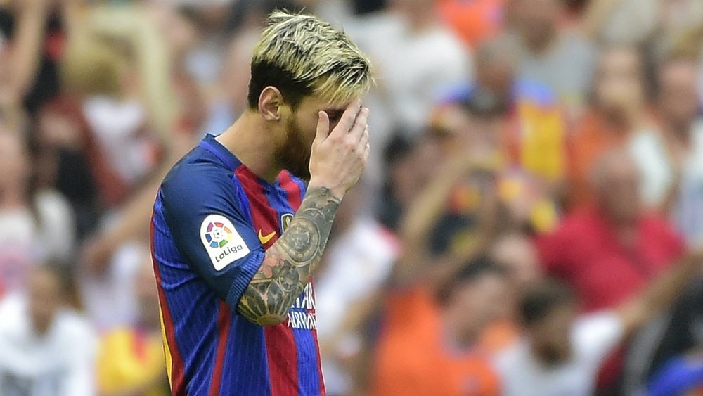 Lionel Messi dans un match contre Valence. AFP