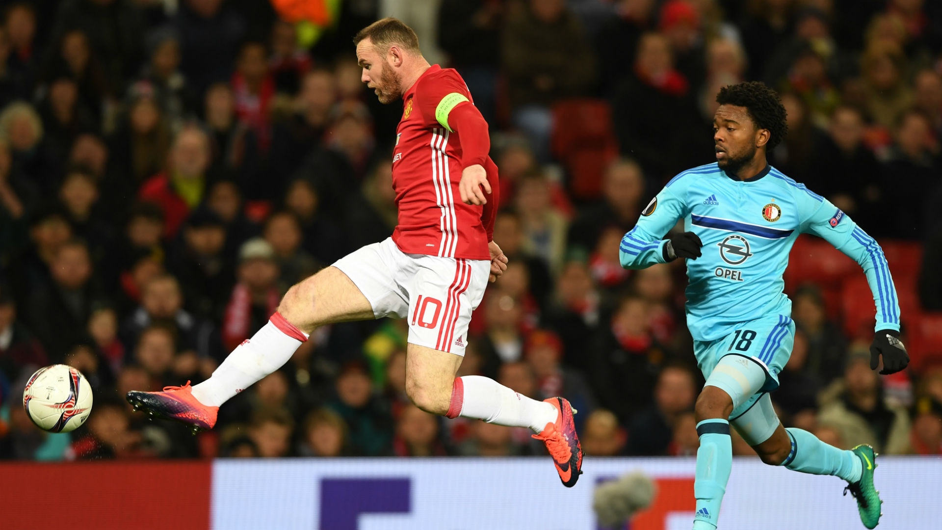 Wayne Rooney kicking the ball during an Europa League match. Goal