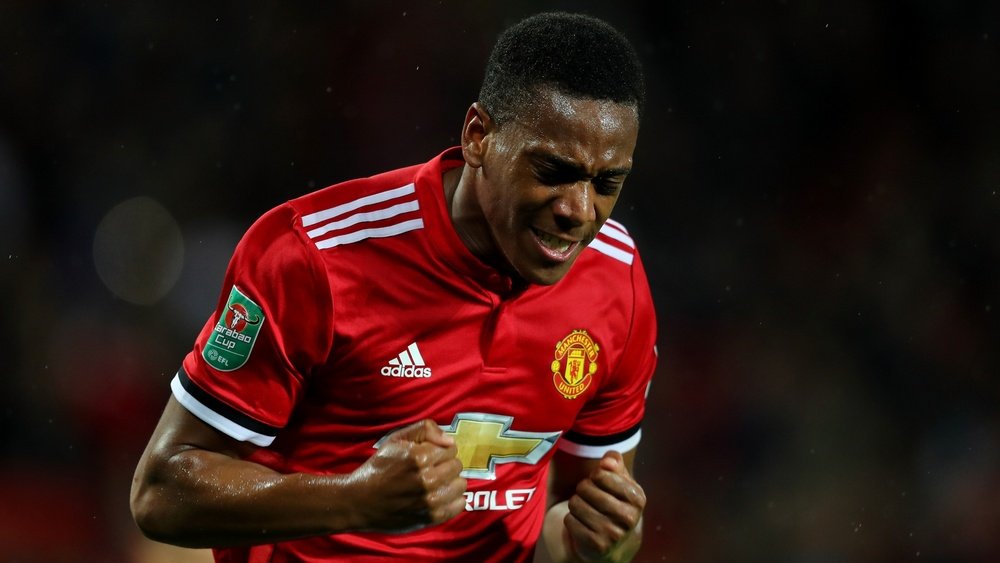 Martial netted for United as they breezed past Burton. AFP