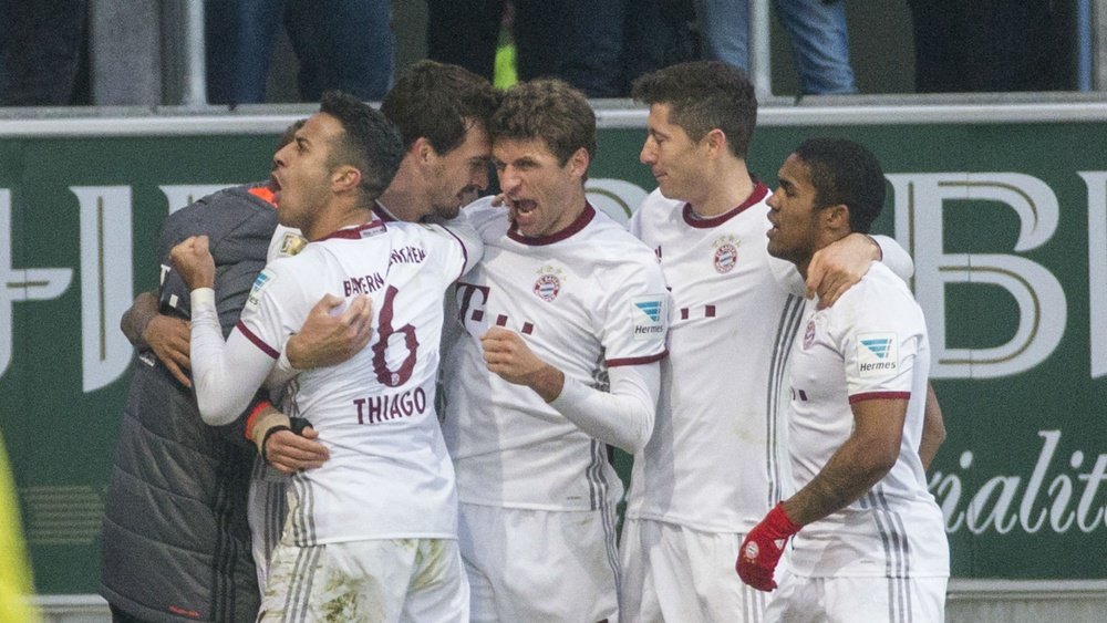 Bayern Munich players celebrating their win. Goal