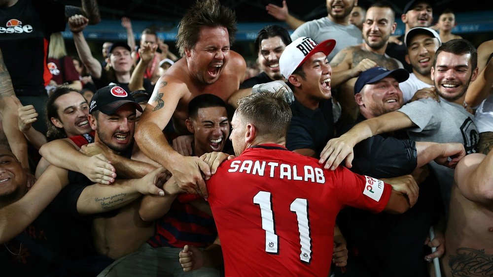 Brendon Santalab celebrating with fans of the Wanderers. Goal