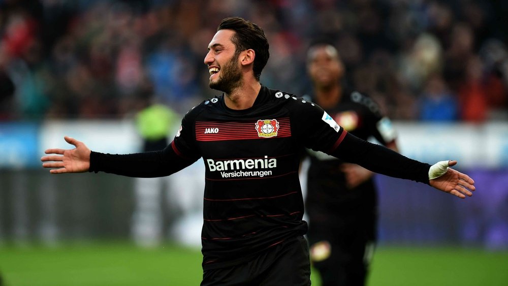 Hakan Calhanoglu celebrating a goal with Leverkusen. Goal