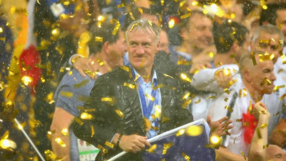 Deschamps was soaked by his players. GOAL