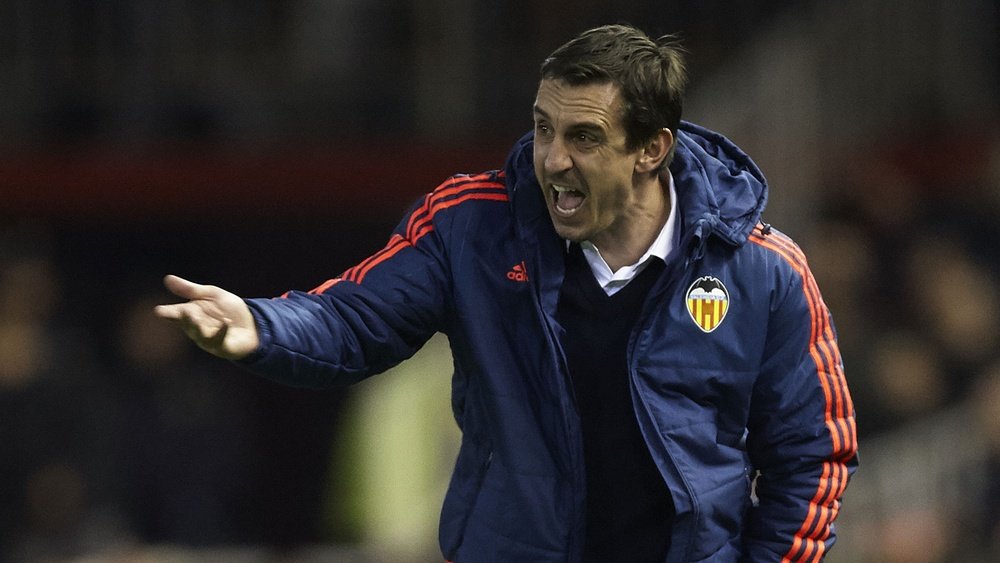 Gary Neville stands on the touchline while in charge of Valencia. Goal
