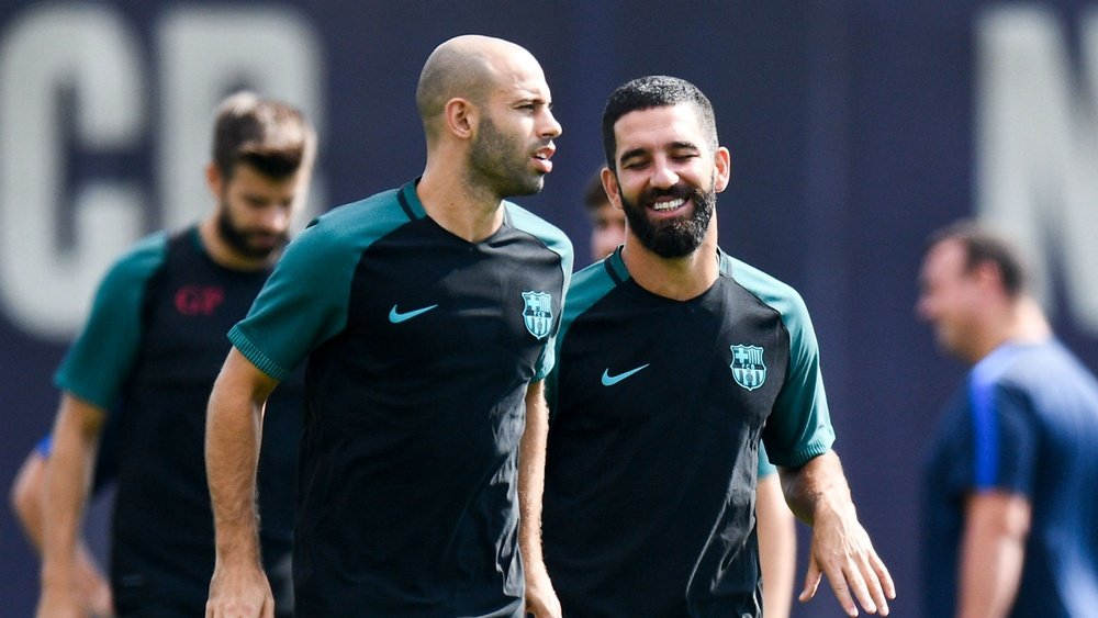 Javier Mascherano with Arda Turan in a training session. Goal