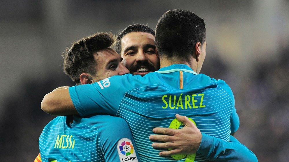Messi, Arda Turan and Luis Suarez celebrating. Goal