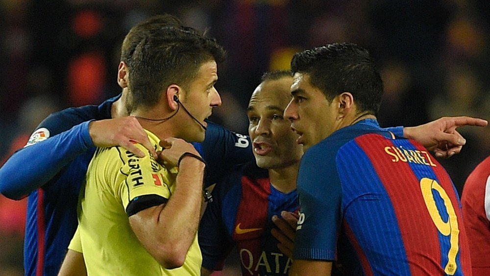 Luis Suarez protests for receiving a second yellow in Tuesday's semi-final. Goal