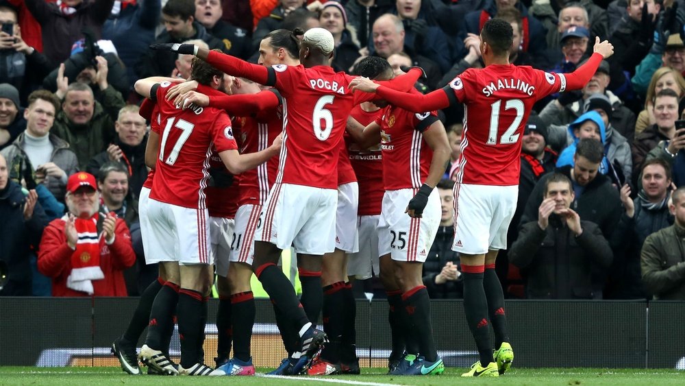 Manchester United players celebrating. Goal
