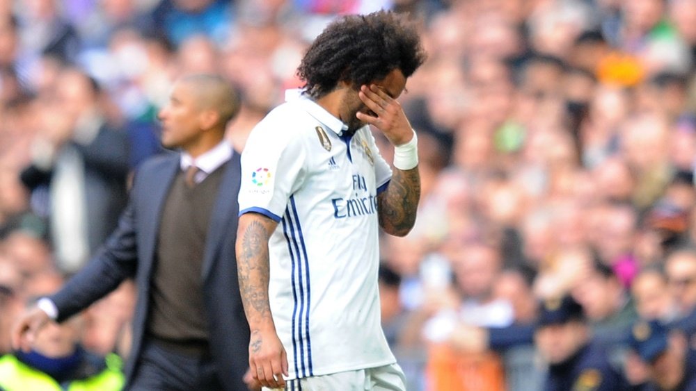 Marcelo walking out the pitch after his injury. Goal