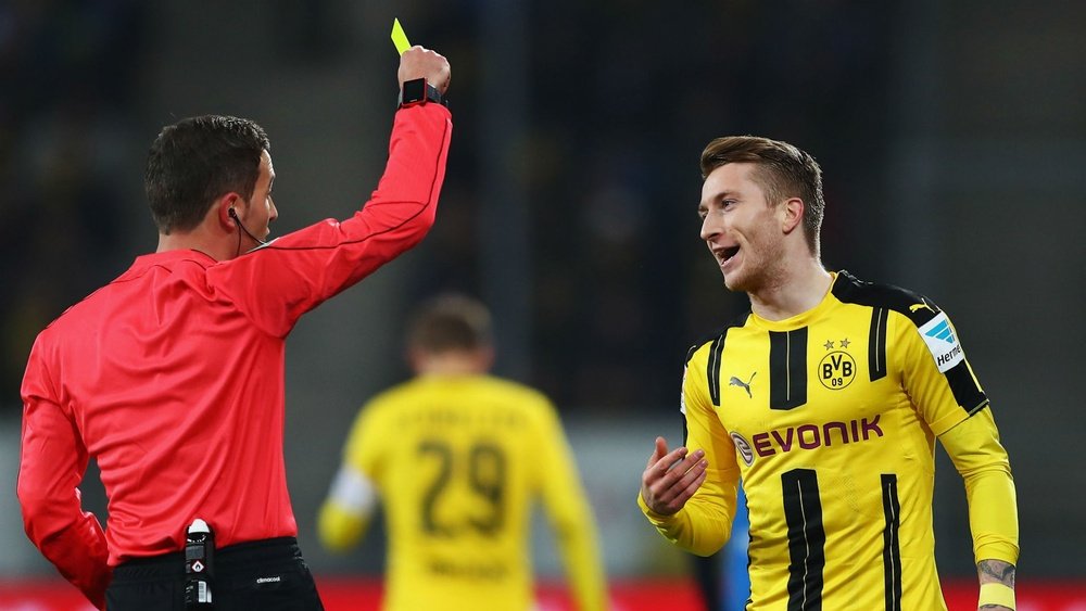 Marco Reus pickis up a yellow card. Goal