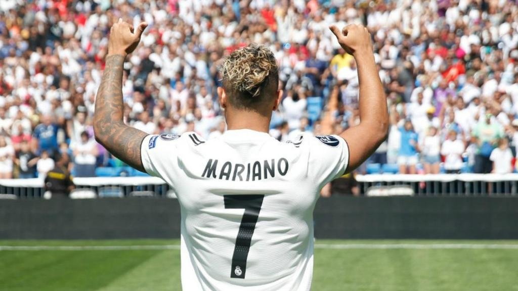 Mariano Diaz poses in a Real Madrid shirt after completing £30m move