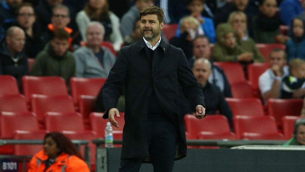 Pochettino was left bemused by referee Mike Dean's refereeing. GOAL
