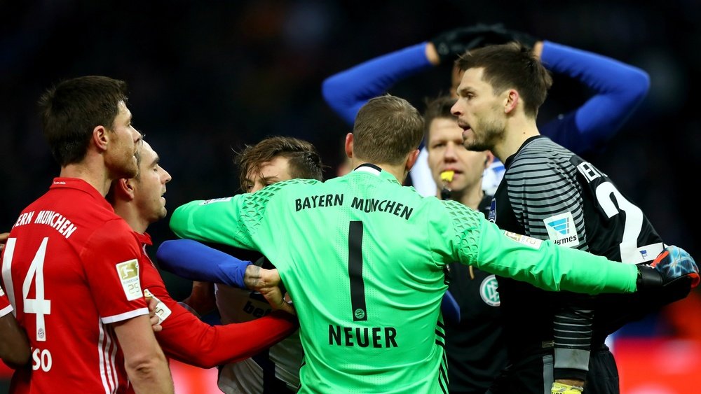Manuel Neuer separating Rune Jarstein from Philippe Lahm. Goal