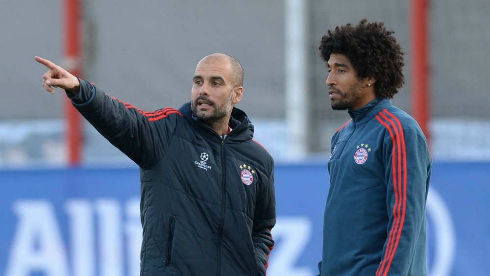 Pep Guardiola with Dante during a training session at Bayern Munich. Goal