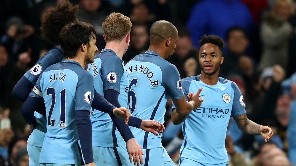 Raheem Sterling celebrates scoring the winner for Manchester City against Arsenal. Goal