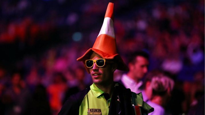 Van Persie wears traffic cone at Premier League Darts