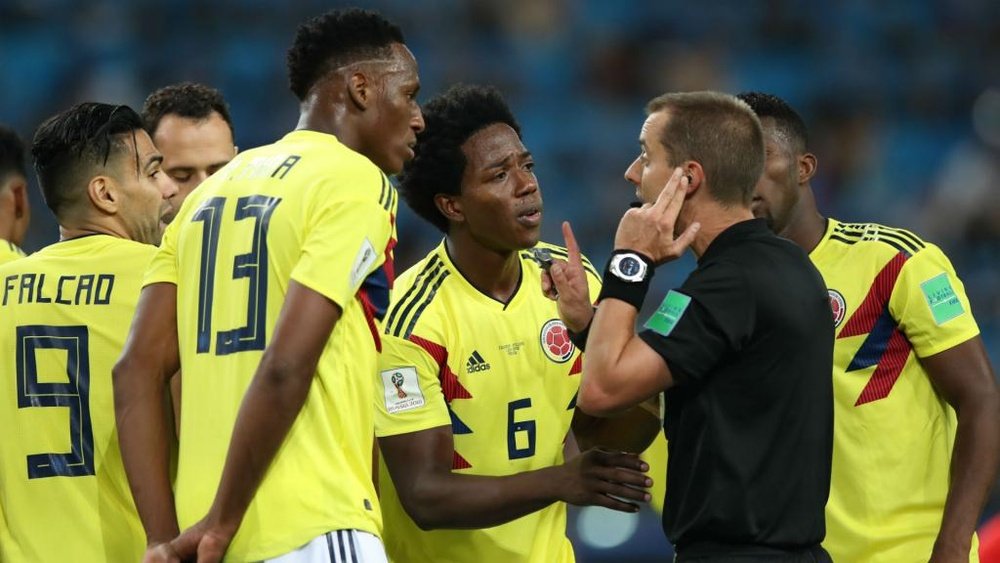 Colombian players surrounded the referee all night. GOAL