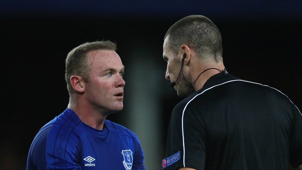 Rooney keen to focus on football after competitive Everton return