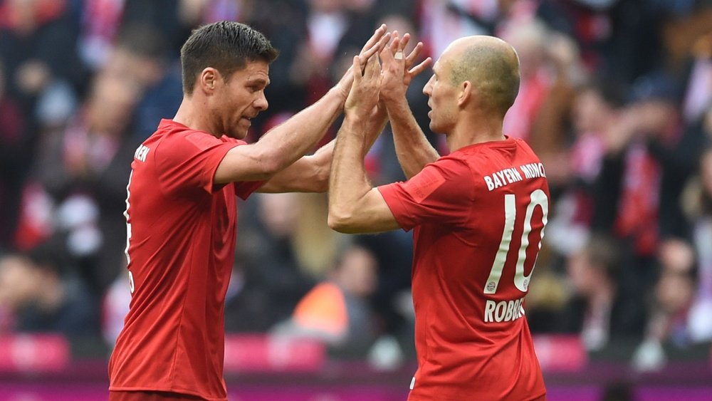 XabiAlonso (L) may retire at the end of the season. Goal