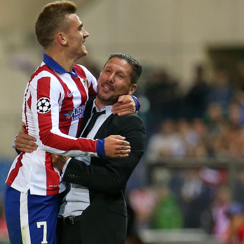 Griezmann and Simeone clebrating a goal. AFP