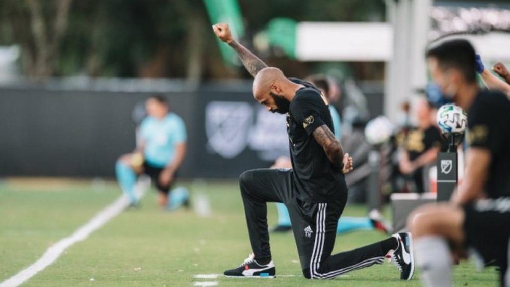 Thierry Henry takes a knee for eight minutes and 46 seconds. Twitter/MLS