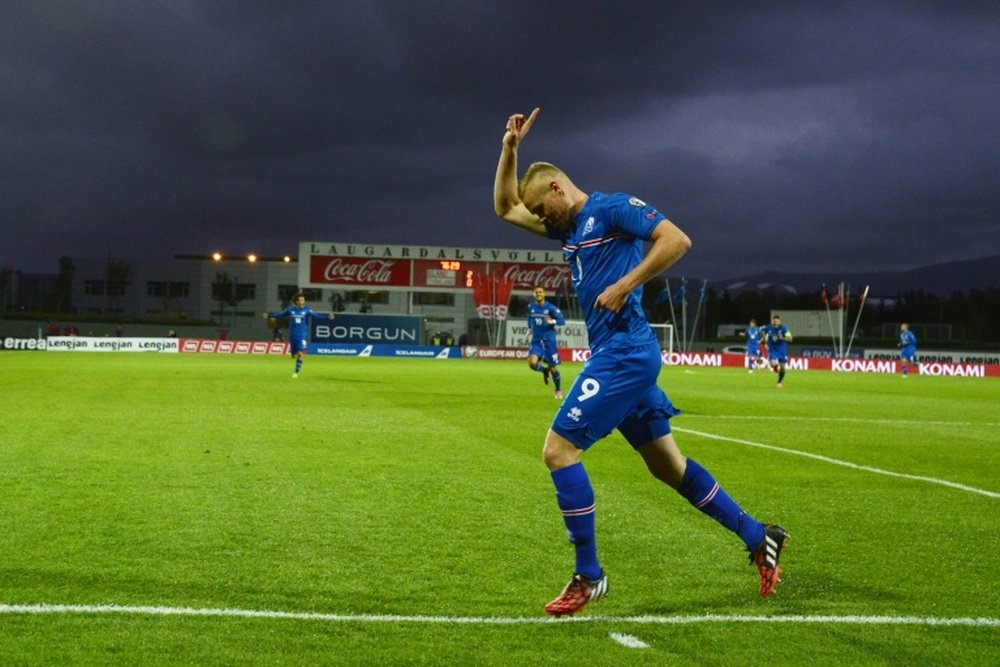 Iceland striker Kolbeinn Sigthorsson celebrates during the UEFA Euro 2016 Group A qualifying football match Iceland vs Turkey on September 9, 2014 in Reykjavik