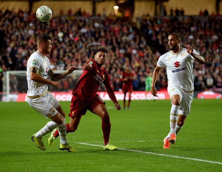 Moore mistake helps Liverpool progress