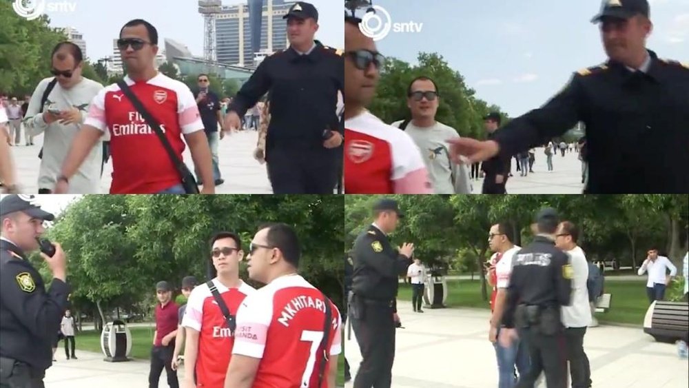 Azeri police stop Arsenal fans with Mkhitaryan shirts on. Capturas/SNTV