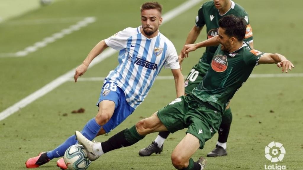 Malaga tie down Ismael Casas, another of their starlets