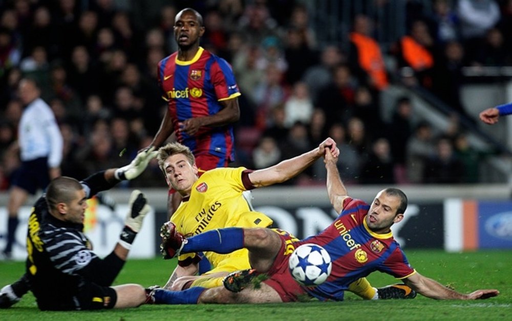 Bendtner in action against Barcelona whilst at Arsenal. AFP