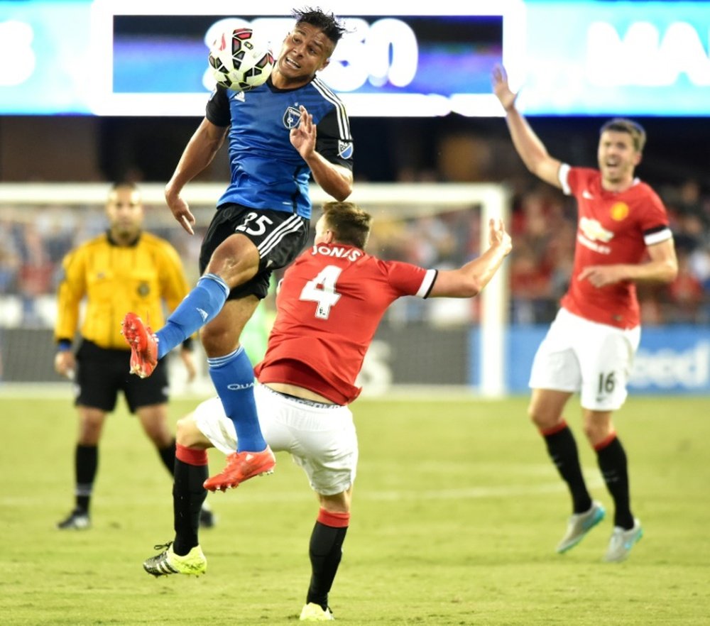JJ Koval (top) of the San Jose Earthquakes jumps for the ball while fending off Phil Jones of Manchester United during an International Champions Cup match at Avaya Stadium in San Jose, California on July 21, 2015