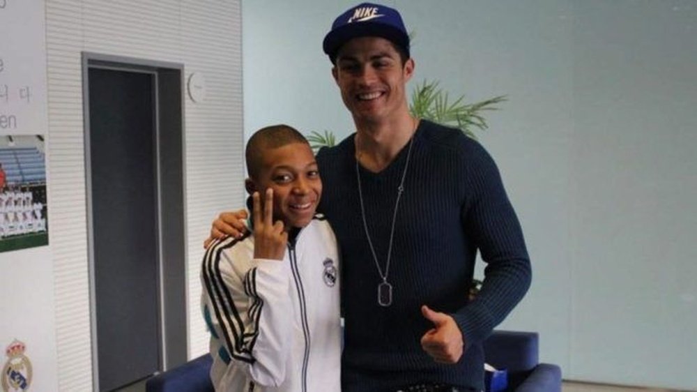 Kylian Mbappé, aged 14 with Cristiano Ronaldo. Twitter