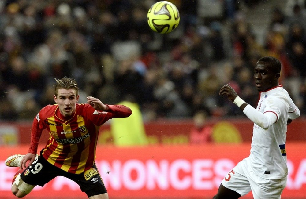 Lens French midfielder Benjamin Bourigeaud (L) challenges Lille Senegalese midfielder Idrissa Gueye during the French L1 football match between Lens and Lille at the Stade de France in Saint-Denis, north of Paris, on December 7, 2014