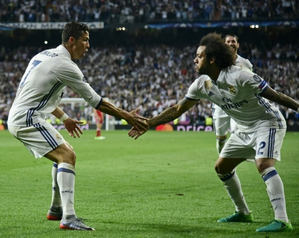 Les joueurs du Real Madrid, Cristiano Ronaldo et Marcelo célèbrent un but en C1. AFP