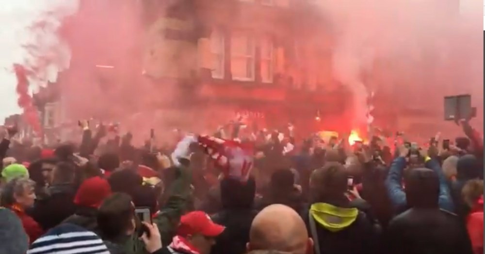 Liverpool fans release flares in the street before kick-off. Twitter/TheTelegraph