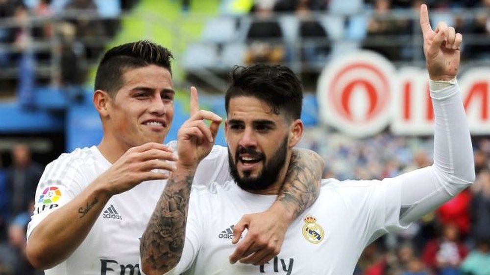 Isco celebrating a goal with James Rodriguez. AFP