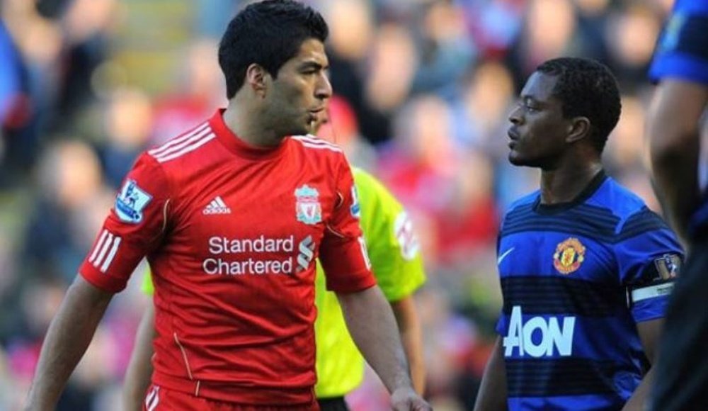 Suarez was banned for racially abusing Evra. AFP