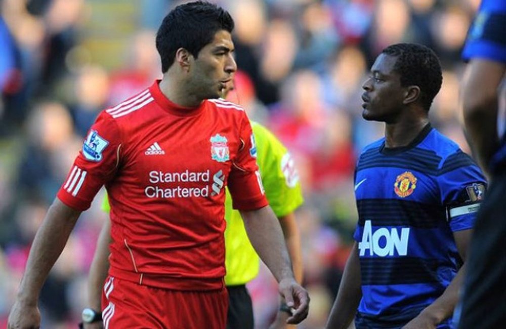 Patrice Evra (R) does not hate Suarez (L) despite racism incident in 2011. AFP