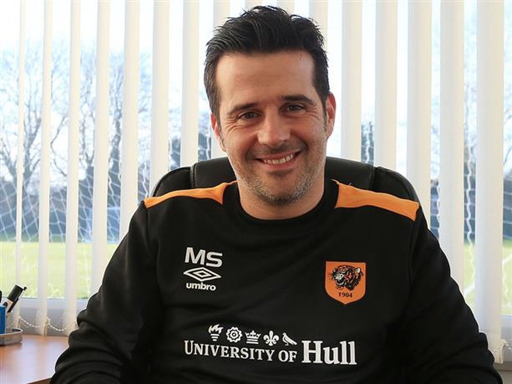 Marco Silva poses for pictures in the manager's office at Hull City. HullCityTigers