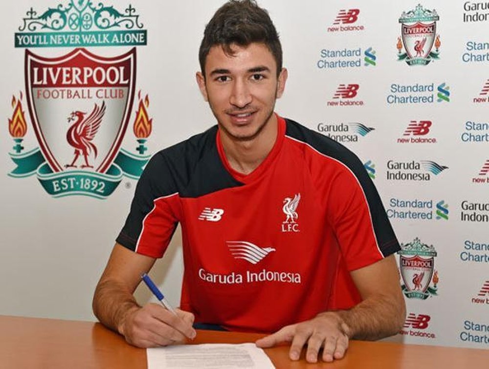 Marko Grujic signing his deal at Liverpool. LiverpoolFC