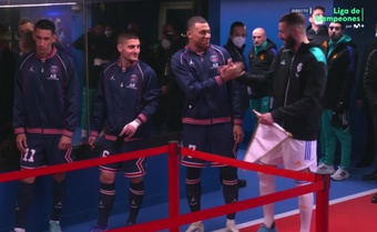 Mates Mbappe and Benzema shake arms in tunnel