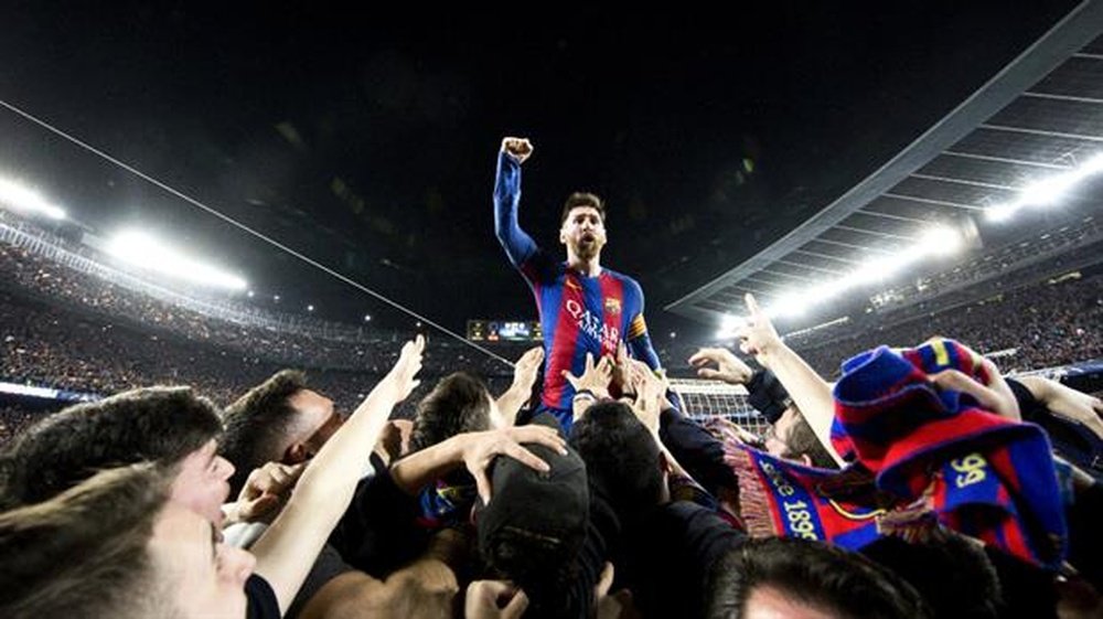 Messi celebrates with fans after the PSG comeback. FCBarcelona/SantiGarcés