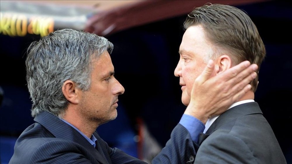 Current manager Jose Mourinho with Louis van Gaal, who was sacked in 2016. AFP